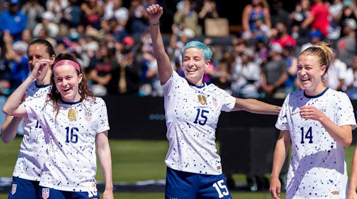 USWNT forward Megan Rapinoe celebrates with her teammates during Women's World Cup.